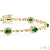 5x3 MM Oval Cut Emerald and 1/20 ctw Single Cut Diamond Bracelet in 10K Yellow Gold